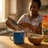 How to make bushera: a mug of Ugandan millet porridge with Maganjo Soya Millet flour pack on a kitchen counter in Dubai